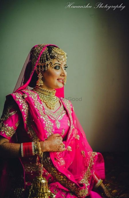 Bridal portrait with bold jewellery and pink lehenga