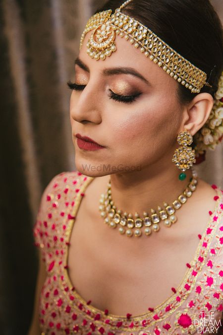Simple bridal choker and mathapatti with pearls 