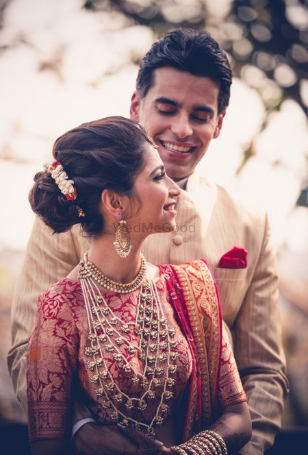 A bride and groom in coordinated outfits 