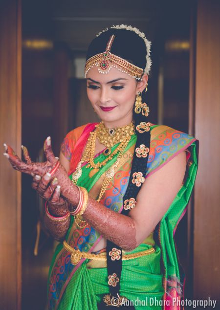 Photo of South Indian bridal look with bride wearing jewellery