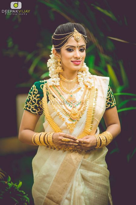 Traditional South Indian bride with layered jewellery