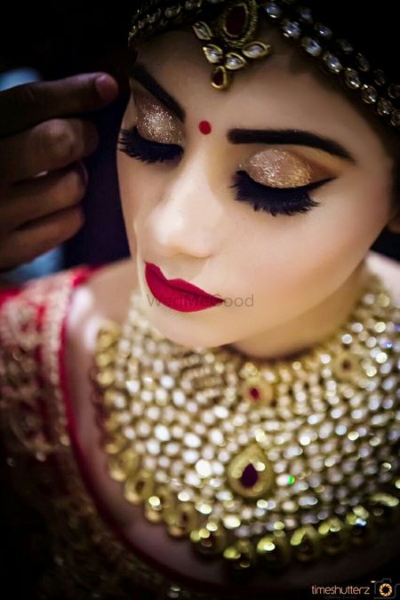 Bride with bold brows and red lips 