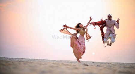 Crazy couple jumping shot after wedding