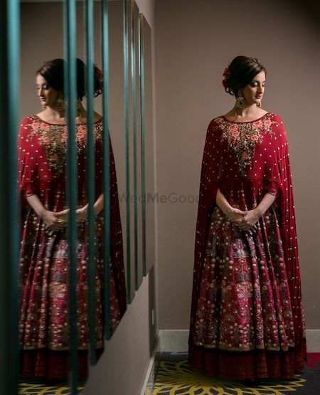 Photo of Sister of the bride maroon outfit with cape