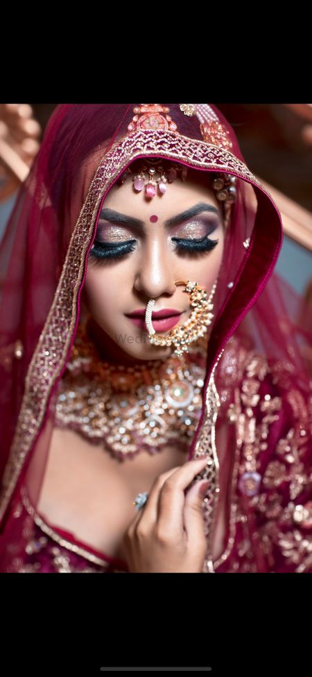 A bride with heavy eye makeup. 