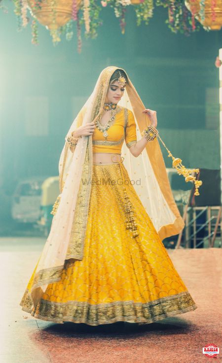 Photo of Offbeat bridal lehenga in yellow colour