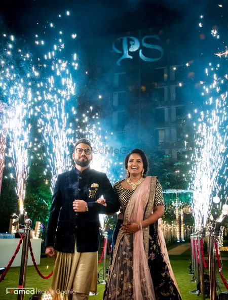 Couple entering on engagement with cold pyros