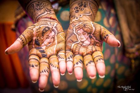 Photo of Bridal mehendi with portraits of bride and groom