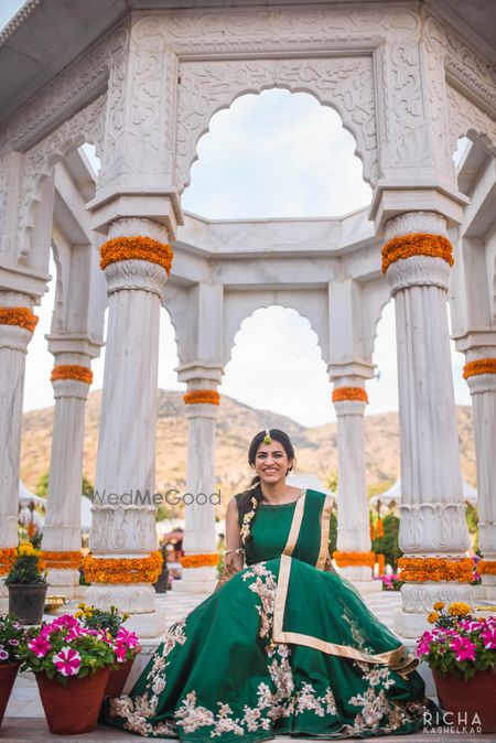 Photo of Dark green lehenga with floral embroidery for mehendi