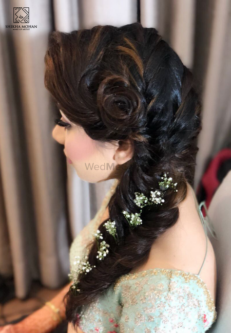 Intricate bridal braid for a mehendi or engagement function