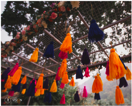 Photo of Mehendi entrance decor with hanging tassels