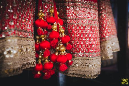 Heavy red bridal lehenga tassels 