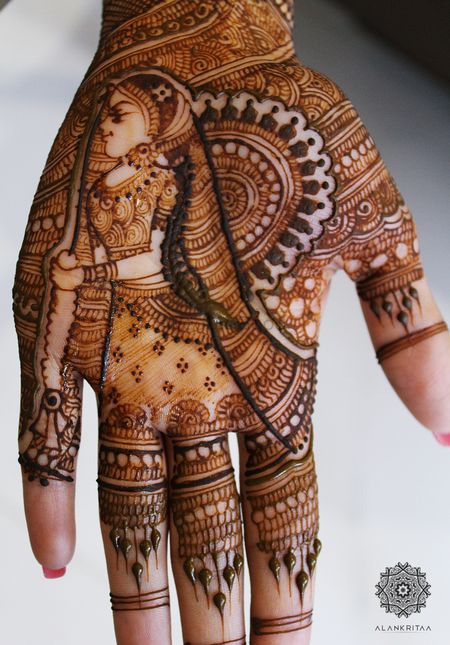 Unique mehendi design with bride holding jaimala