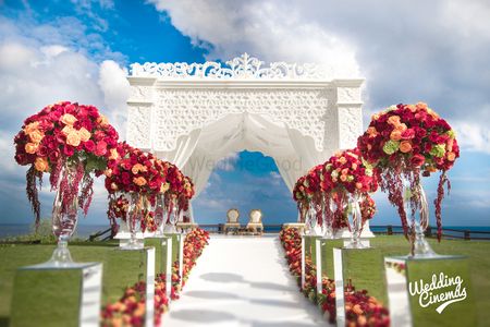 Destination wedding mandap with floral aisle