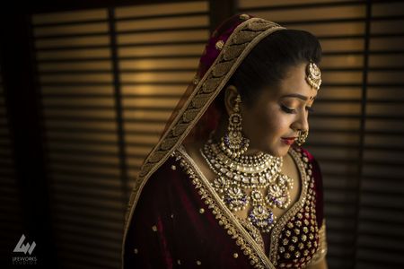 Shy bridal portrait with pretty jewellery 