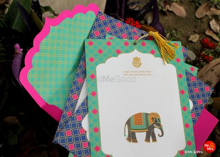 Green and pink fort wedding card with elephant motif