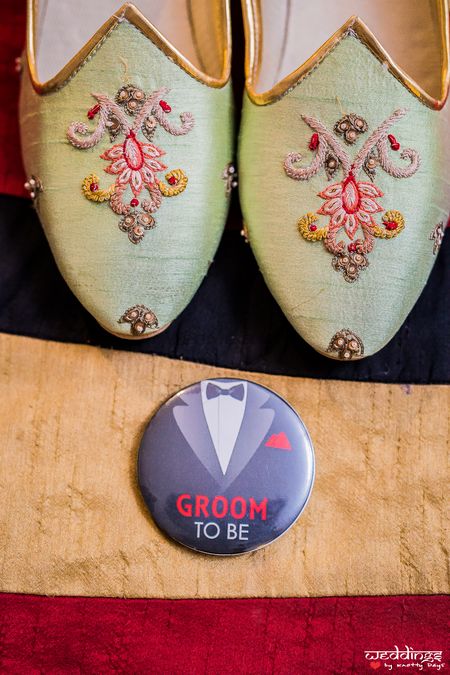 Groom shoes and badge 