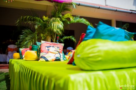 Mehendi decor idea with quirky cushions