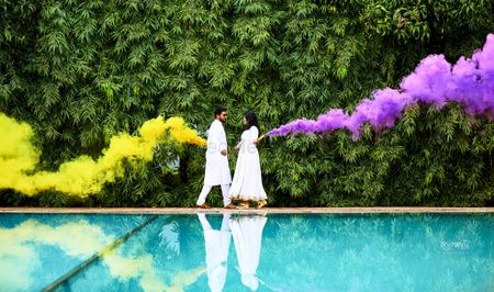 Smoke stick prop in pre wedding shoot yellow purple