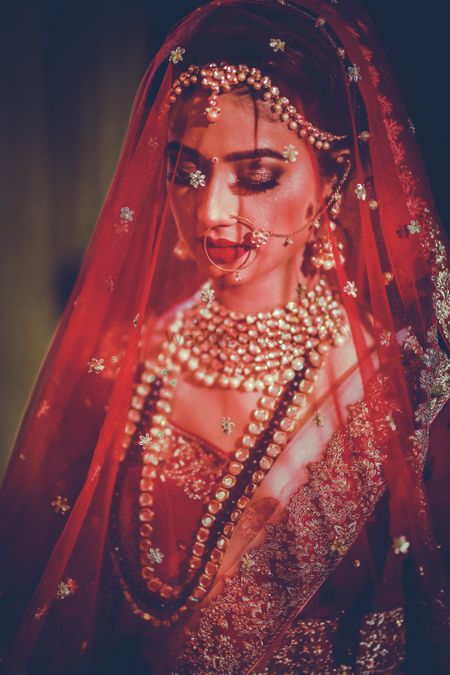 Bridal portrait idea with dupatta as veil