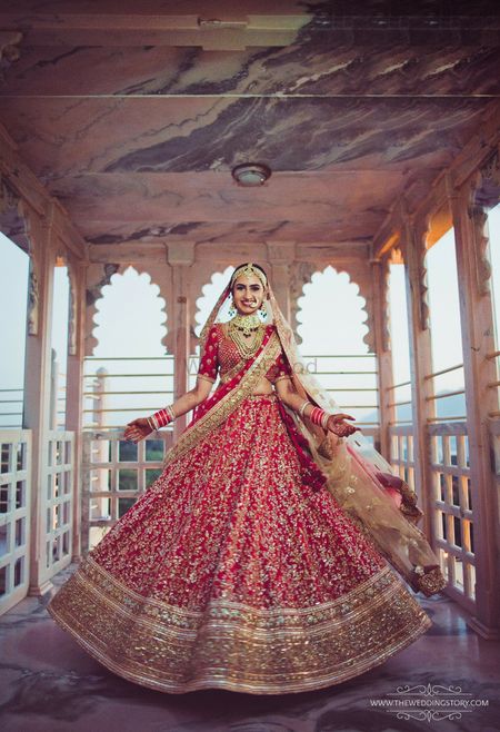 Red and gold bridal lehenga with sequin work 