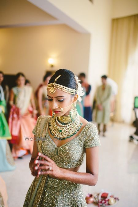 A bride in shimmer lehenga