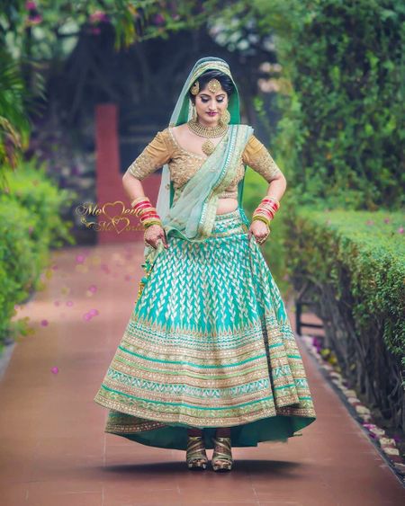 Unique and offbeat bridal hue turquoise lehenga 