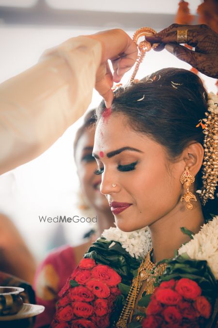 A south Indian bride getting sindoor in her head