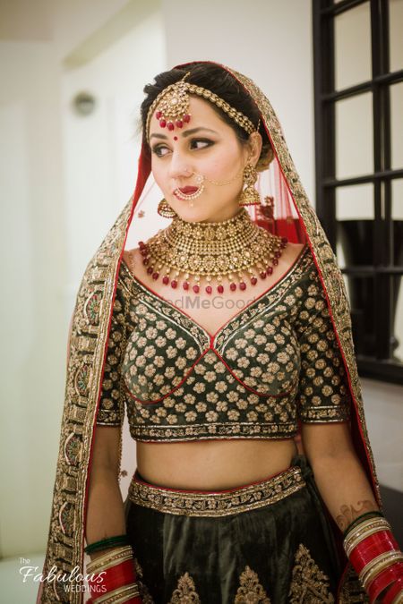 Red and black bridal lehenga with unique blouse 