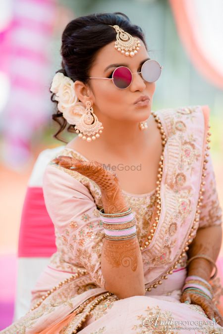 Photo of Mehendi bridal portrait wearing sunglasses
