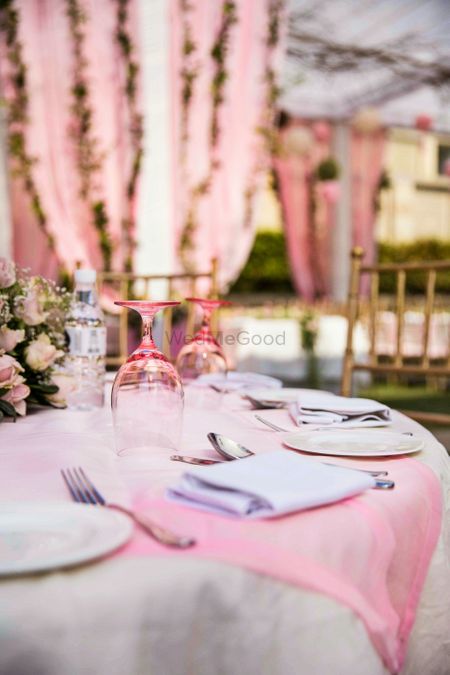 Stunning pink and white table settings with floral centerpieces