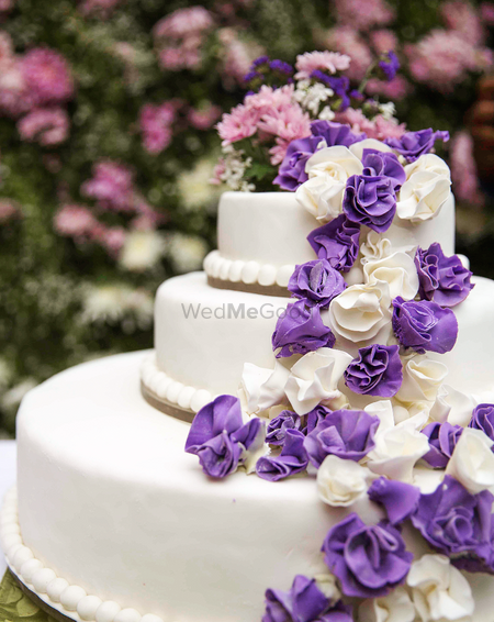3 tier purple and white floral cake 