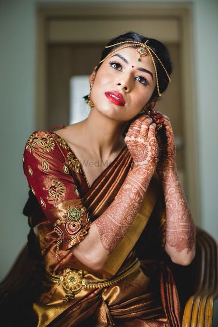 South Indian bridal look with dull gold kanjivaram 