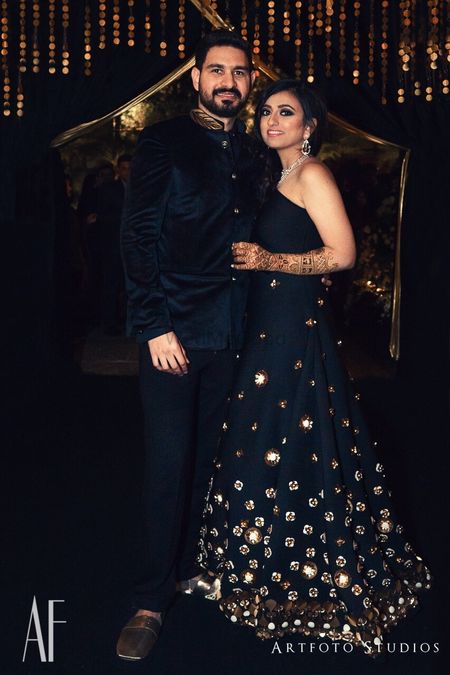 Photo of Black cocktail gown with gold work for sangeet