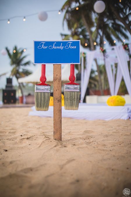 Beach wedding idea with brush to remove sand 