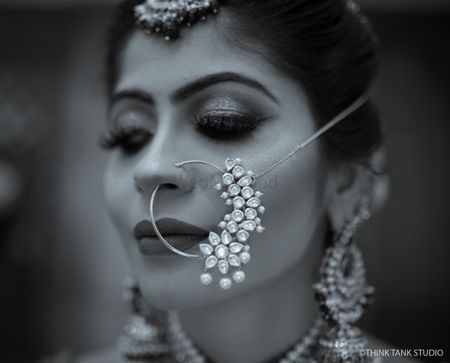 Photo of Unique modern bridal Nath with stones
