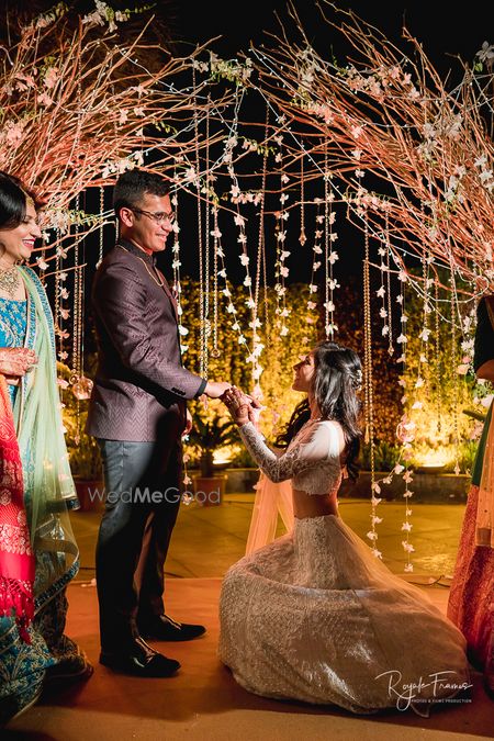 Engagement couple shot with bride proposing groom