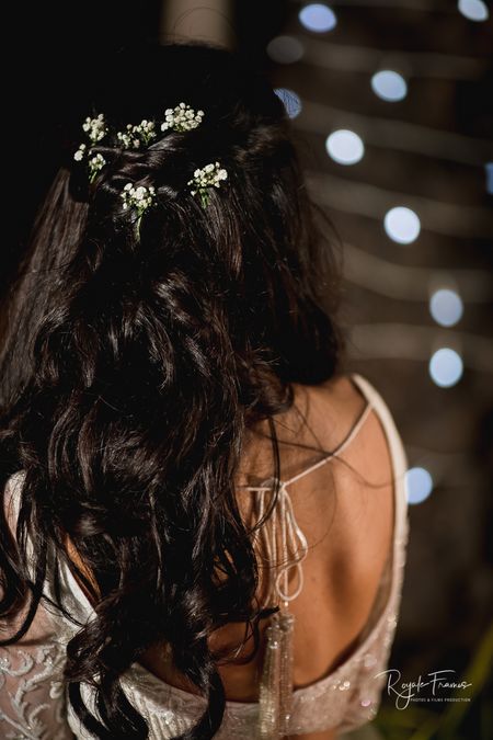Engagement hairstyle with open hair and babys breath