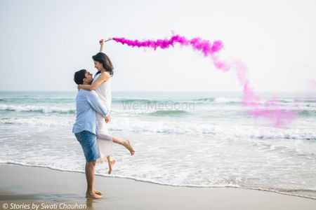 Beautiful smoke bombs in a beach themed pre wedding shoot