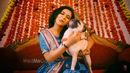 Photo of Bridal portrait with dog on mehendi