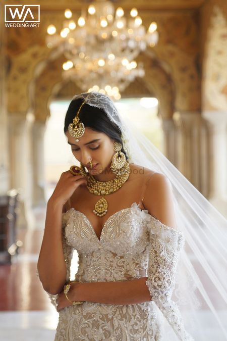 Strapless wedding gown with gold jewellery