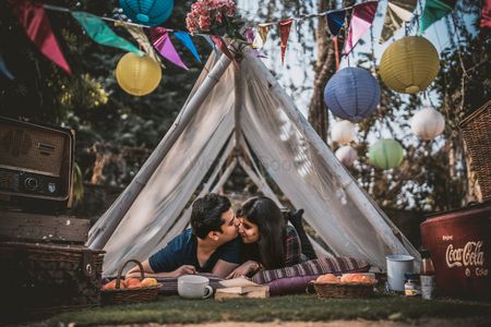 Lovely camping pre wedding shoot with vintage decor and casual outfits