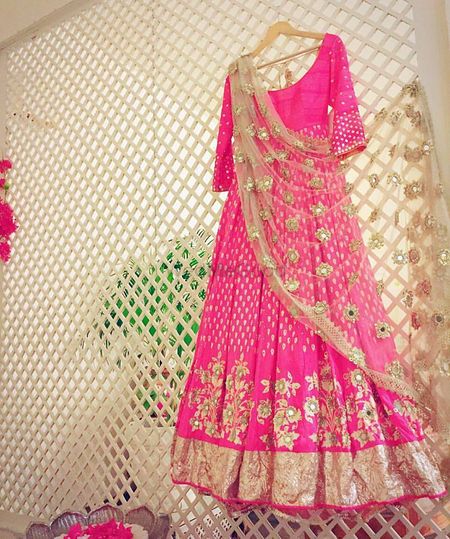 Stunning bright pink and gold floor length anarkali with work all over