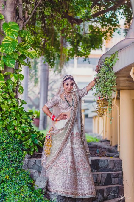 Offwhite bridal lehenga with floral embroidery 