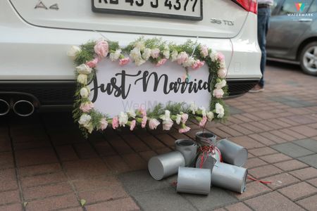 Couple exit ideas in just married car