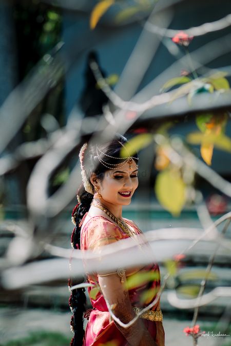 South Indian bridal portrait through tree