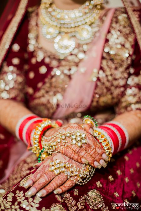 Bridal hands with mehendi and haathphool 