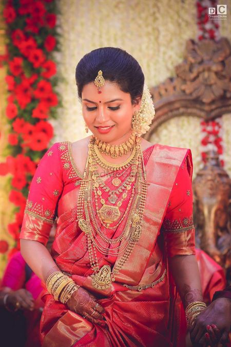 South Indian bride @sakshi5106 looks beautiful in Kanjeevaram saree , gajra  laden hairstyle @shubham_hair_designer & statement making jew... | Instagram
