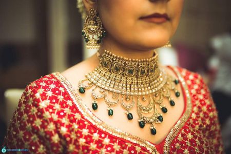 Contrasting bridal bib necklace with green beads 