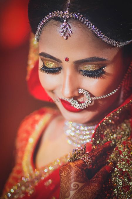 Beautiful bridal makeup with gold shimmer eye makeup